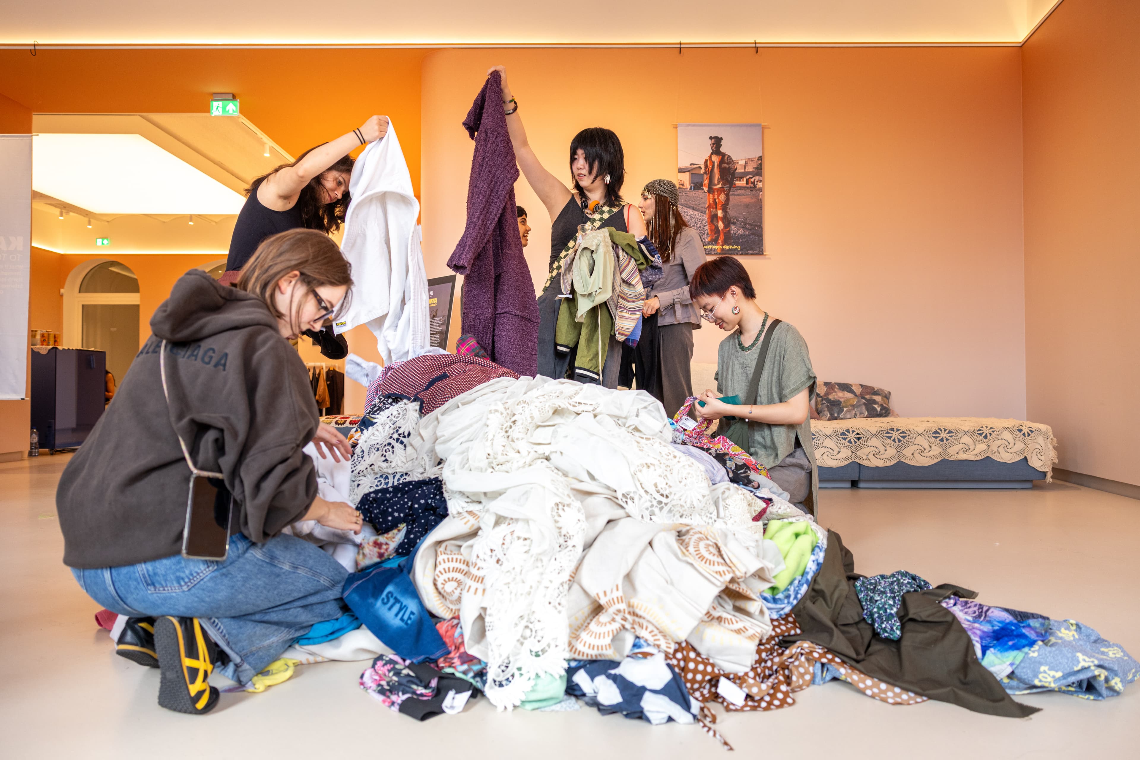 Remanufacture First. Regional hubs + community-centred processing.